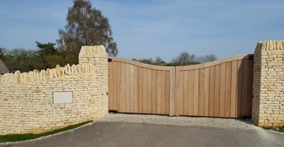 A pair of residential wooden electric gates, installed to the latest industry standards by our experienced engineering team.